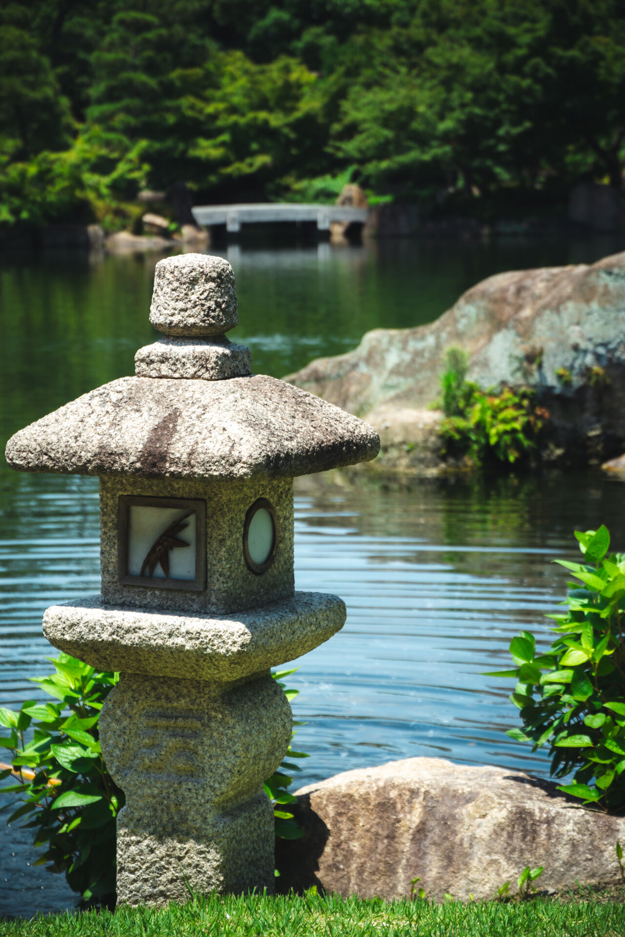 a lantern guarding the pond at Tokugawa-en